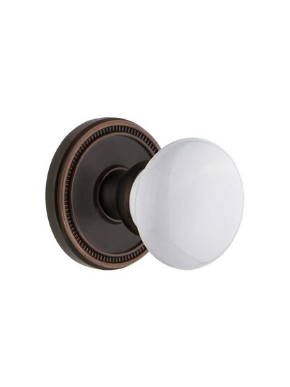 Grandeur Soleil Rosette Door Set with Hyde Park Porcelain Knobs in Timeless Bronze.